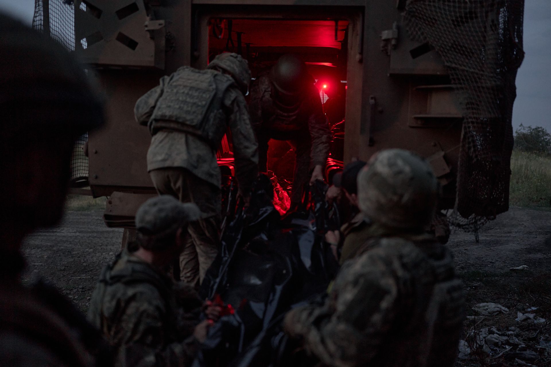 A deceased soldier is evacuated from an infantry position on the border between Donetsk and Dnipropetrovsk oblasts, Ukraine, on July 21, 2025.