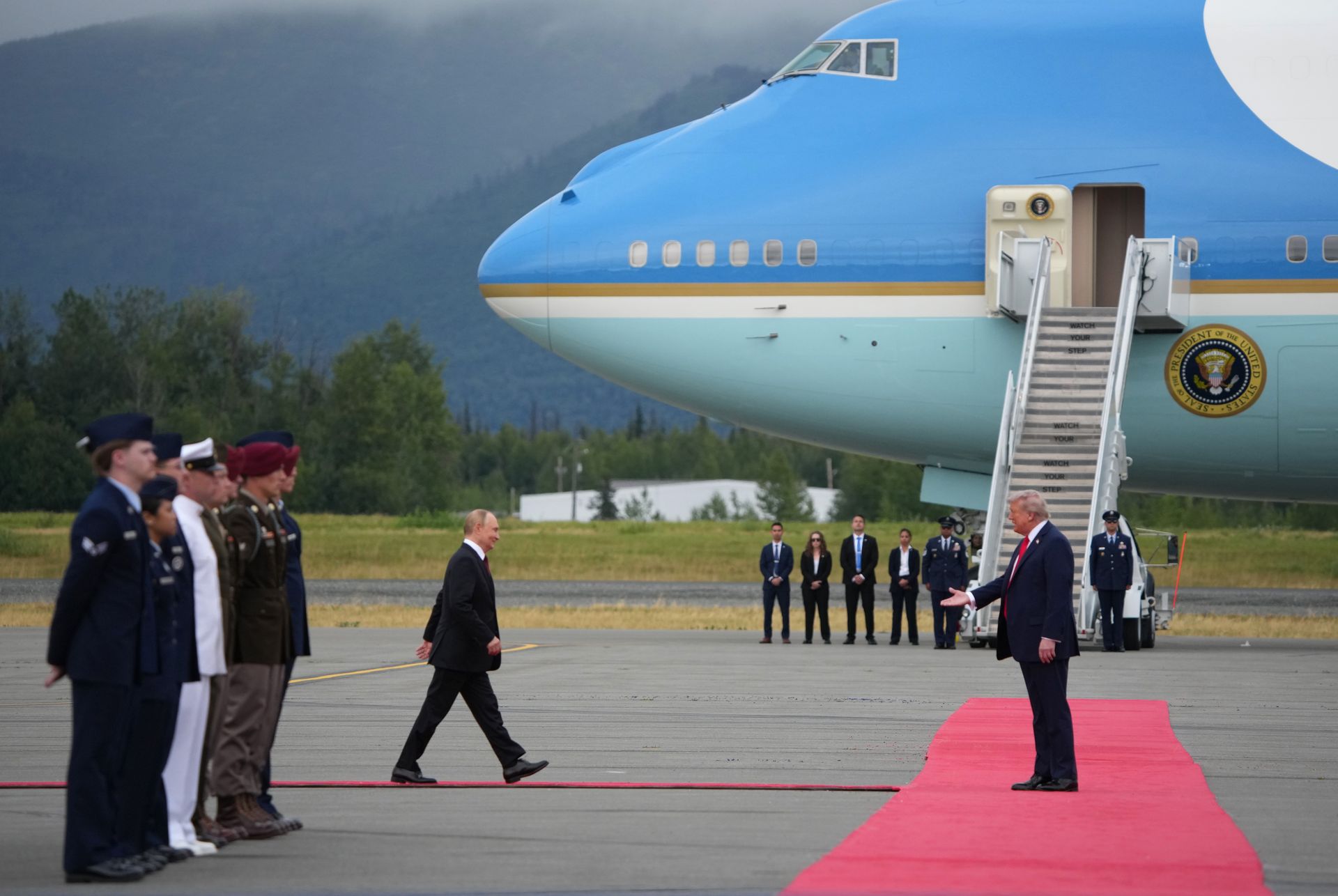 U.S. President Donald Trump (R) greets Russian President Vladimir Putin (L) as he arrives at Joint Base Elmendorf-Richardson in Anchorage, Alaska, U.S. on Aug. 15, 2025. 