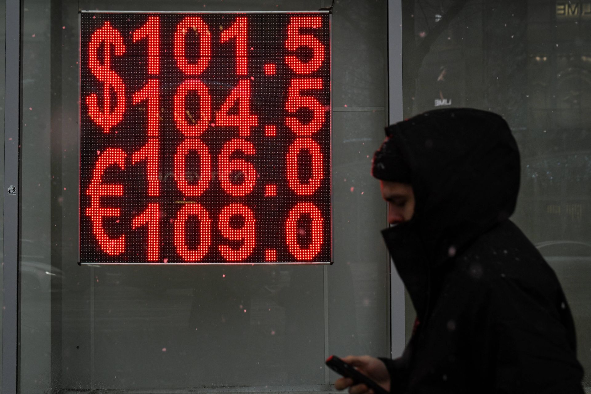 A man walks past a currency exchange office in Moscow, Russia, on Nov. 23, 2024. 