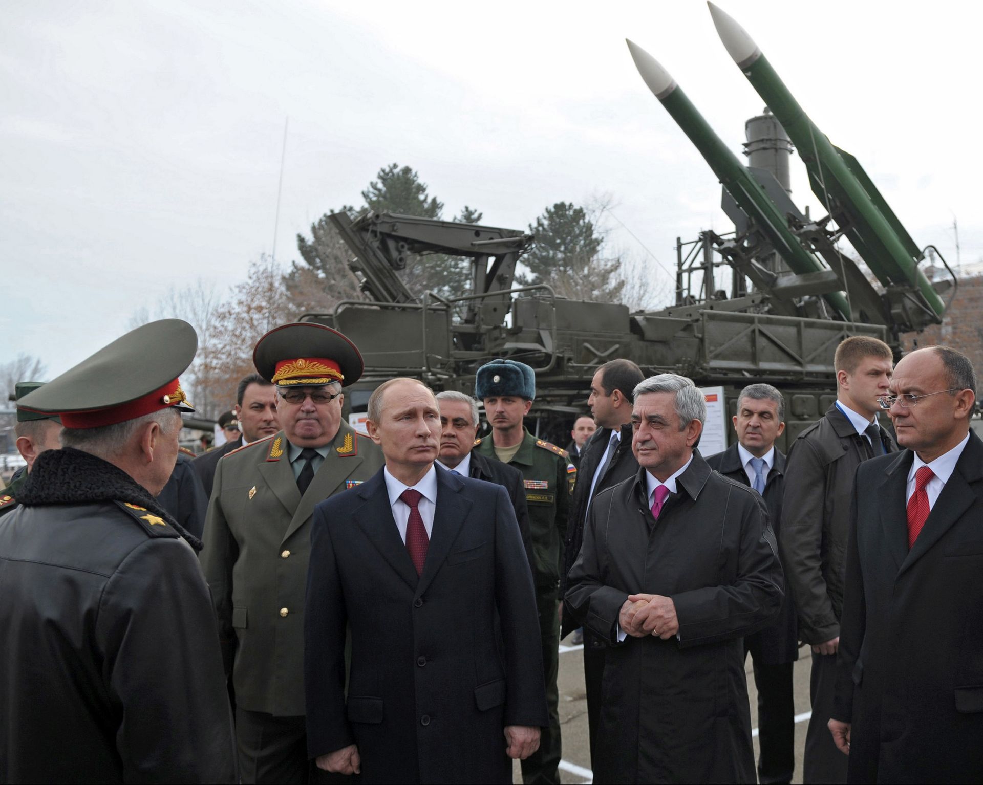 Russian President Vladimir Putin (3rd L) and then-Armenian President Serzh Sargsyan (3rd R) visit the Russian military base in Gyumri, Armenia, on Dec. 2, 2013.