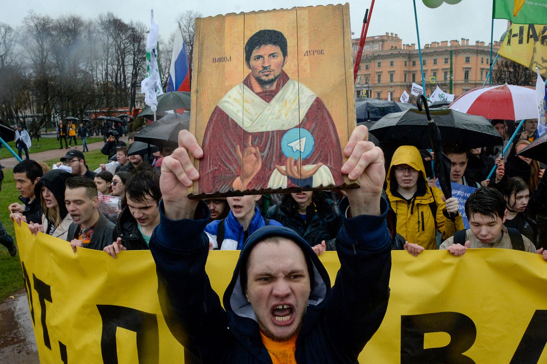 Demonstrators hold a stylized icon painting depicting Telegram founder Pavel Durov during a protest against the blocking of the popular messaging app in Russia, at a May Day rally in Saint Petersburg, Russia, on May 1, 2018.