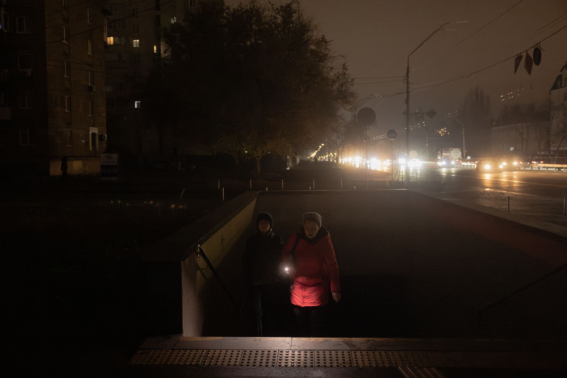 People walk out of an underground passage during a blackout in Kyiv, Ukraine, on Nov. 9, 2025