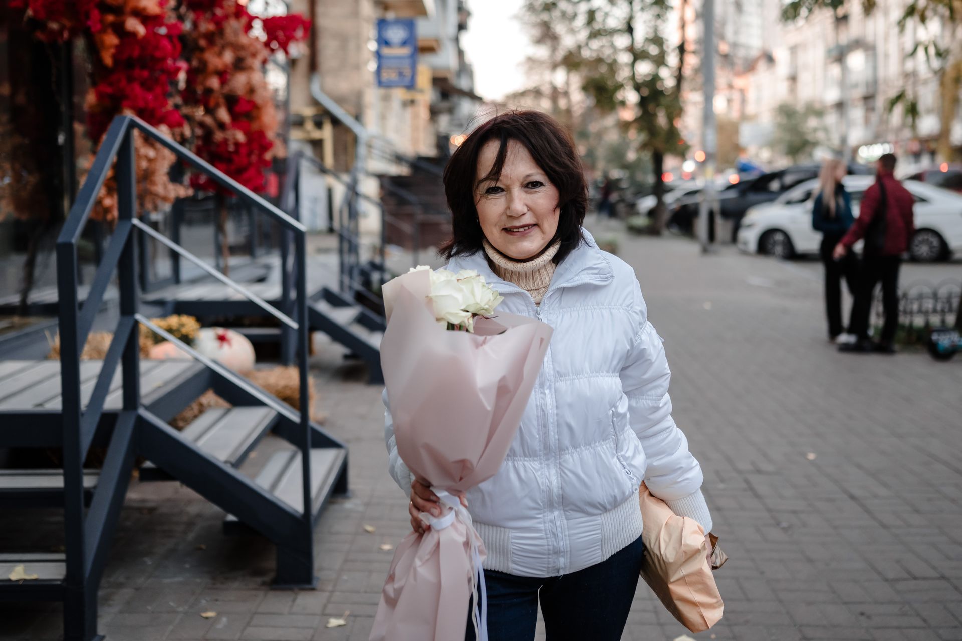 Olena Holovach outside a Flora de Luxe flower shop after buying roses for her sister in Kyiv, Ukraine, on Nov. 7, 2024.