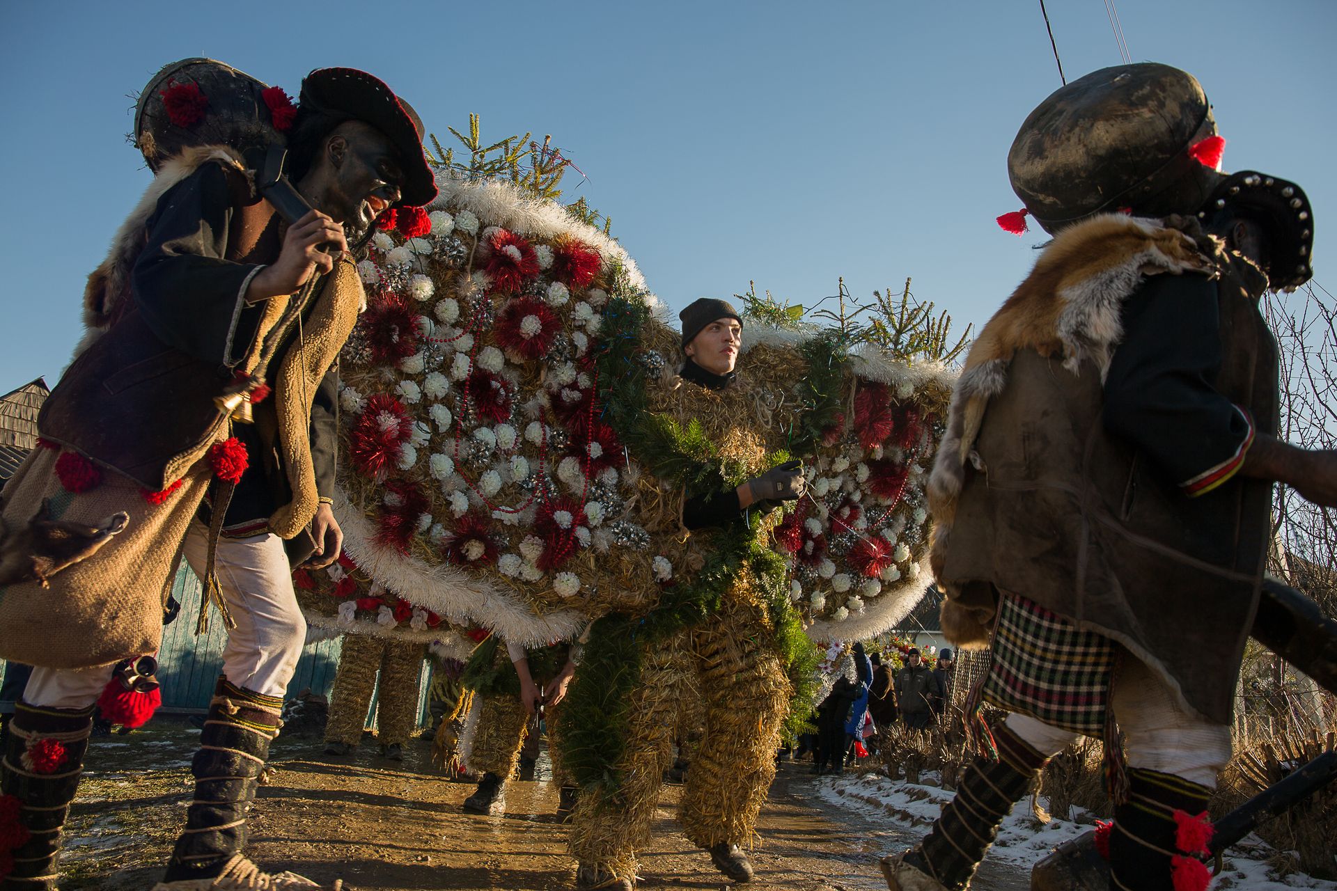 Young men take part in Malanka celebrations wearing traditional costumes in Krasnoilsk, Chernivtsi Oblast, Ukraine, on Jan. 14, 2022.