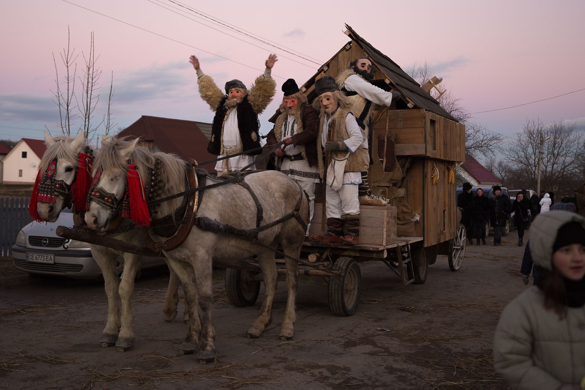 People in traditional costumes arrive in the village center during Malanka celebrations in Krasnoilsk, Chernivtsi Oblast, Ukraine, on Jan. 14, 2022. 