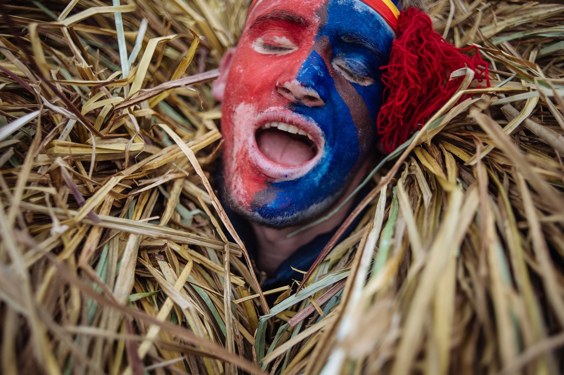 A man dressed in a Malanka costume sings during the Malanka holiday celebration in Krasnoilsk, Chernivtsi Oblast, Ukraine, on Jan. 14, 2014.