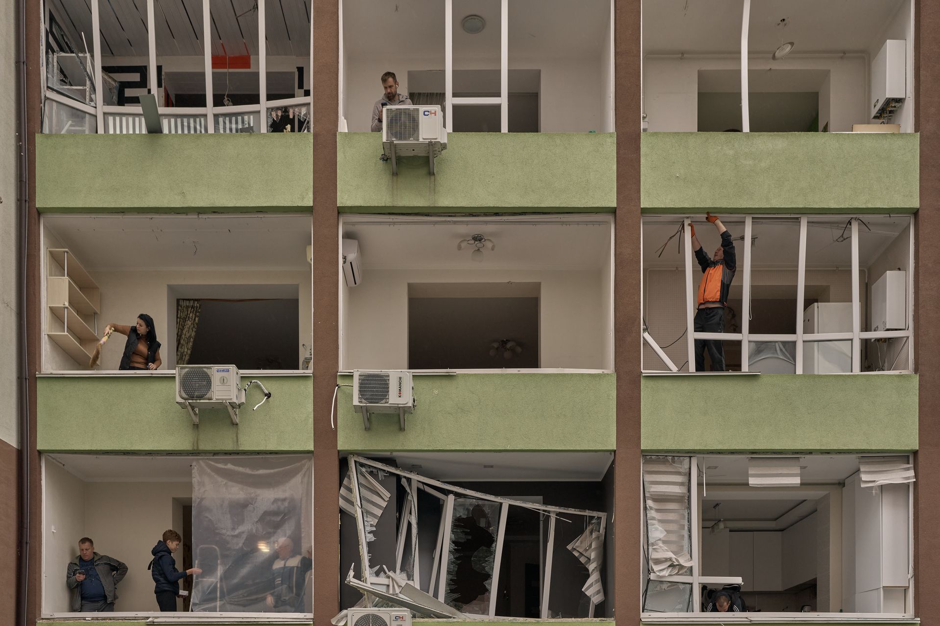 Townhouses are seen destroyed and damaged on the outskirts of Kyiv following a Russian overnight attack, as emergency workers continue clearing debris at multiple strike sites across the capital region.