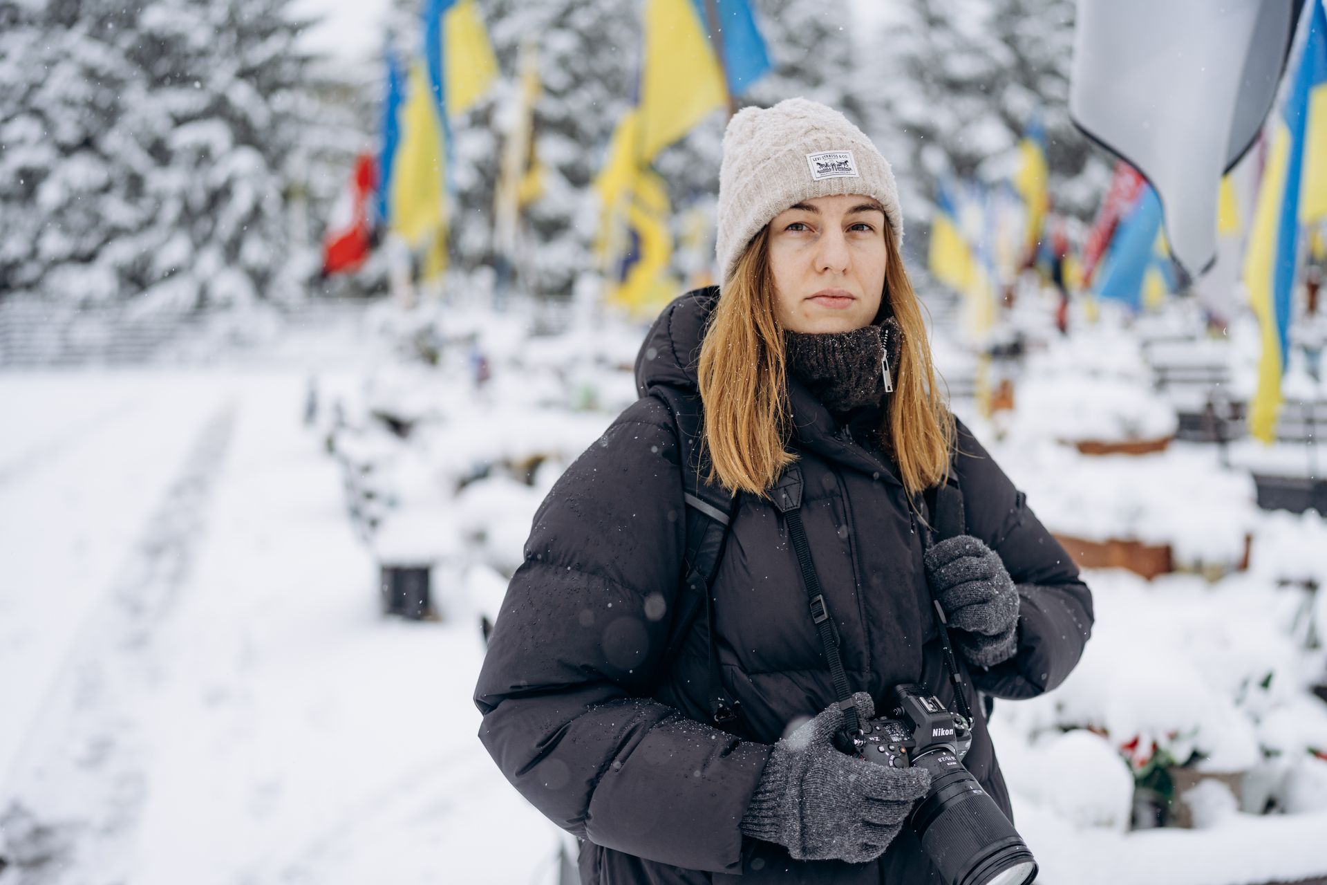 Photographer Anastasia Smolienko documents a burial at the Field of Honor, in Lviv, Ukraine, on Nov. 22, 2025. 