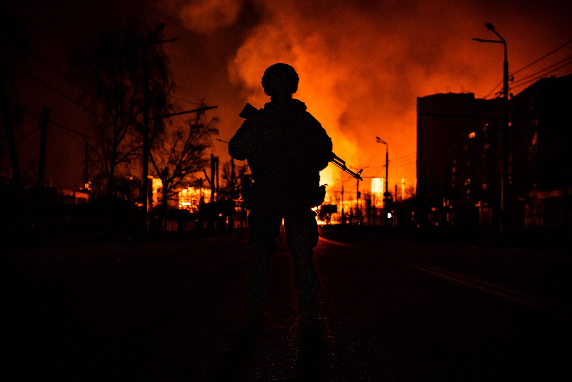 A member of Ukraine’s special forces stands in silhouette following Russian attacks in Kharkiv, Ukraine, on March 30, 2022.