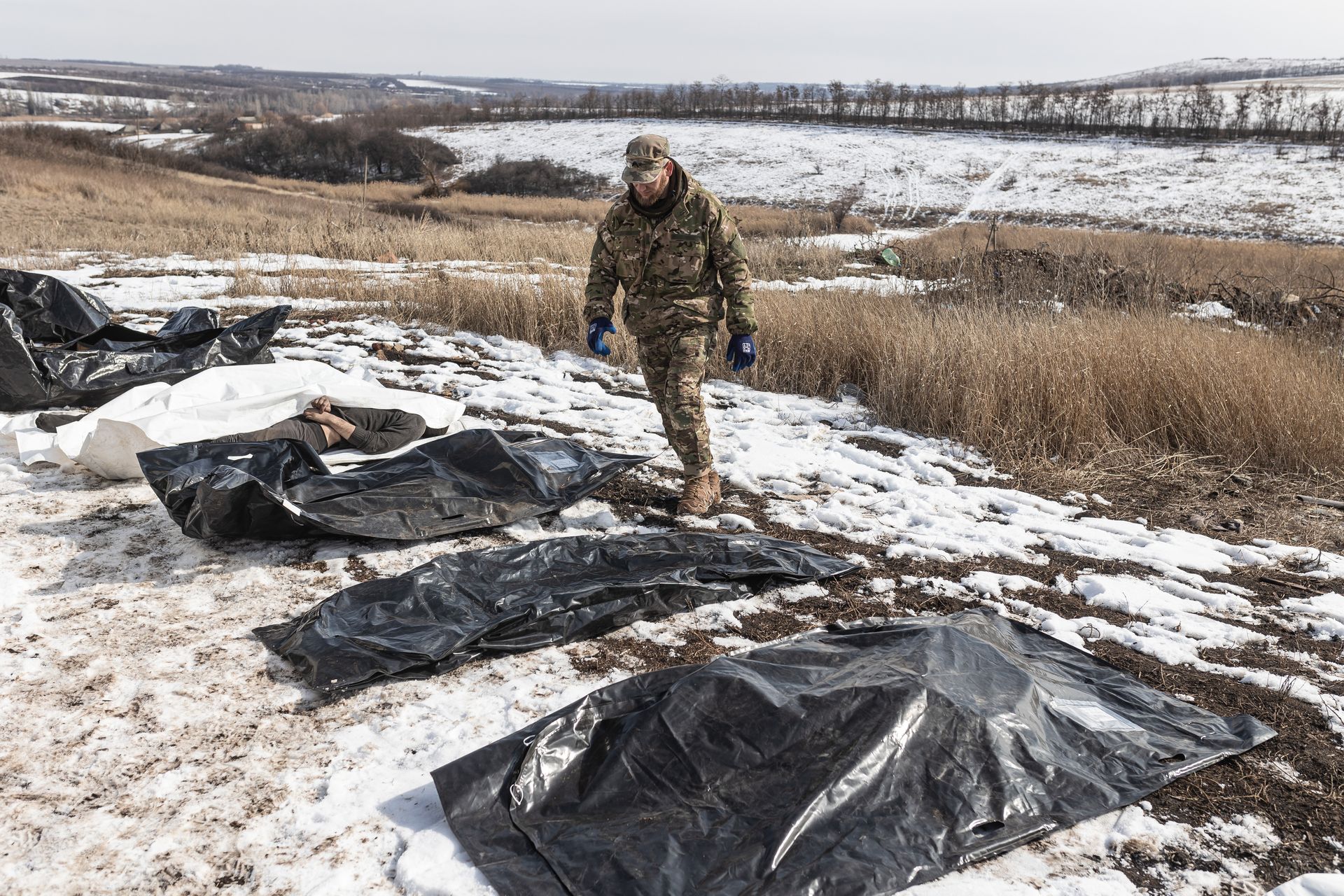 Volunteers from the Ukrainian organization Platsdarm collect and transport the bodies of deceased Russian soldiers from combat positions at an undisclosed location in Donetsk Oblast, Ukraine, on March 2, 2025