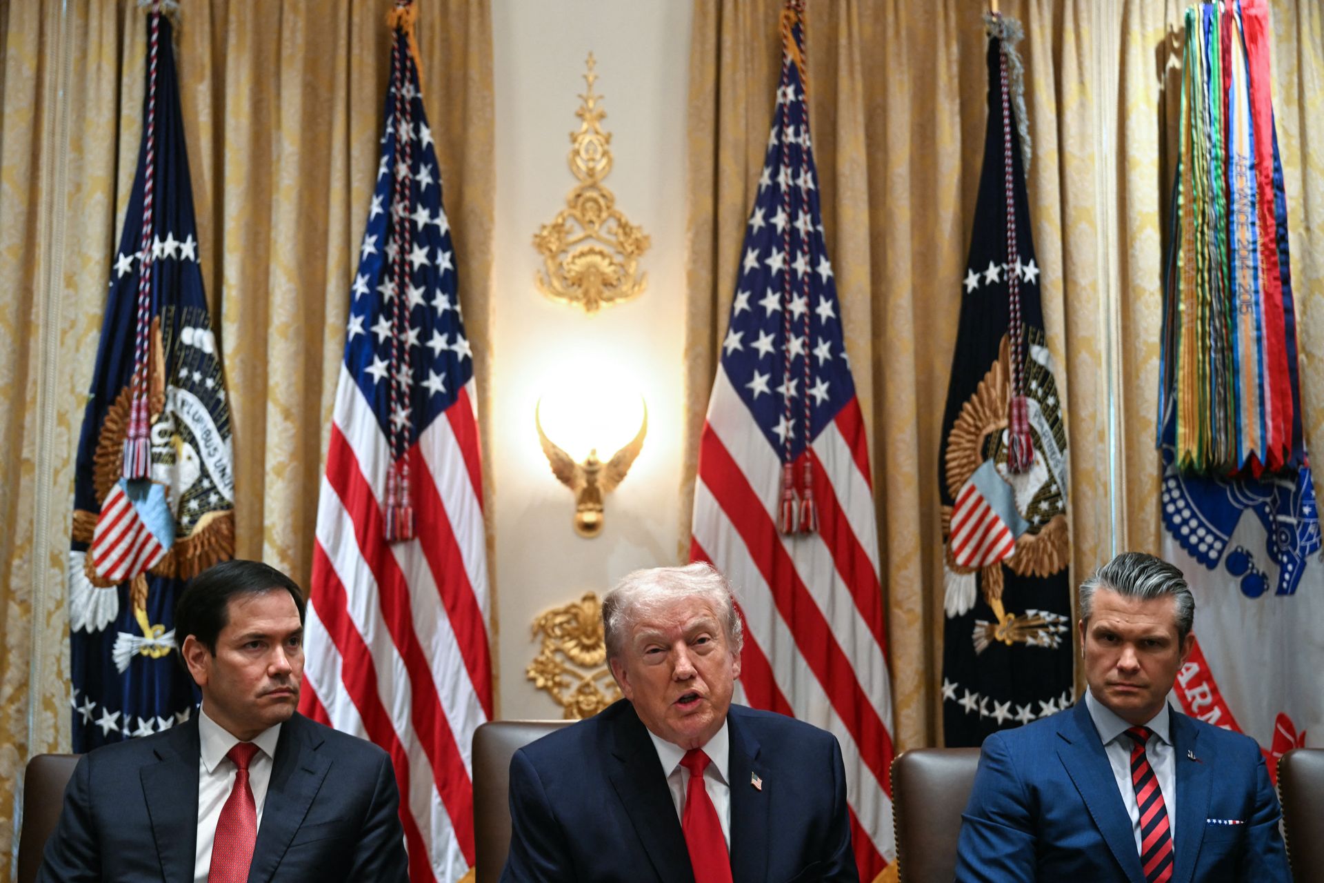 U.S. President Donald Trump (C) speaks alongside Secretary of State Marco Rubio (L) and Defense Secretary Pete Hegseth (R) in Washington, D.C., on Jan. 29, 2026.