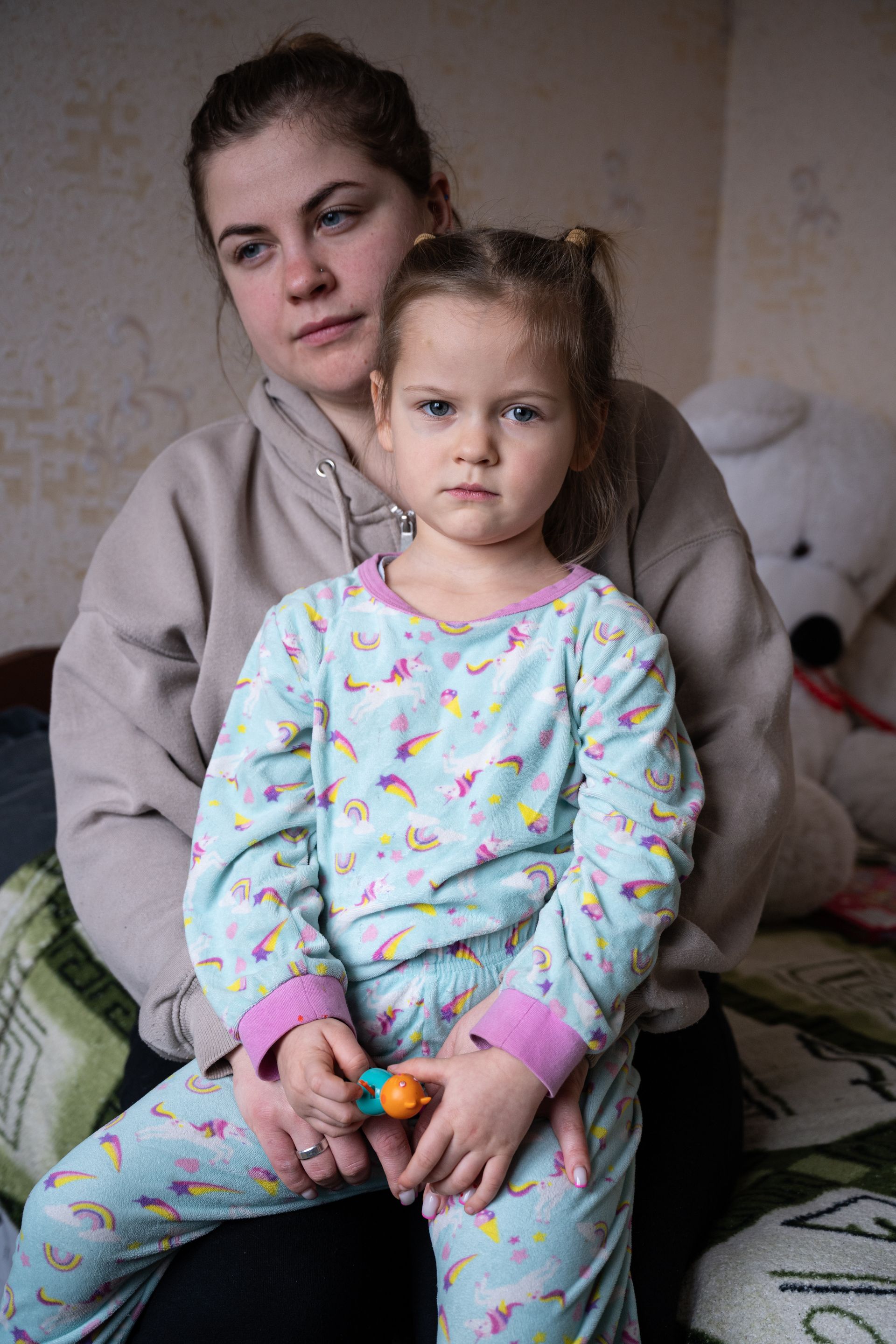 Daria and her daughter Taia are seen in their apartment in Kyiv, Ukraine, on Jan. 27, 2026.