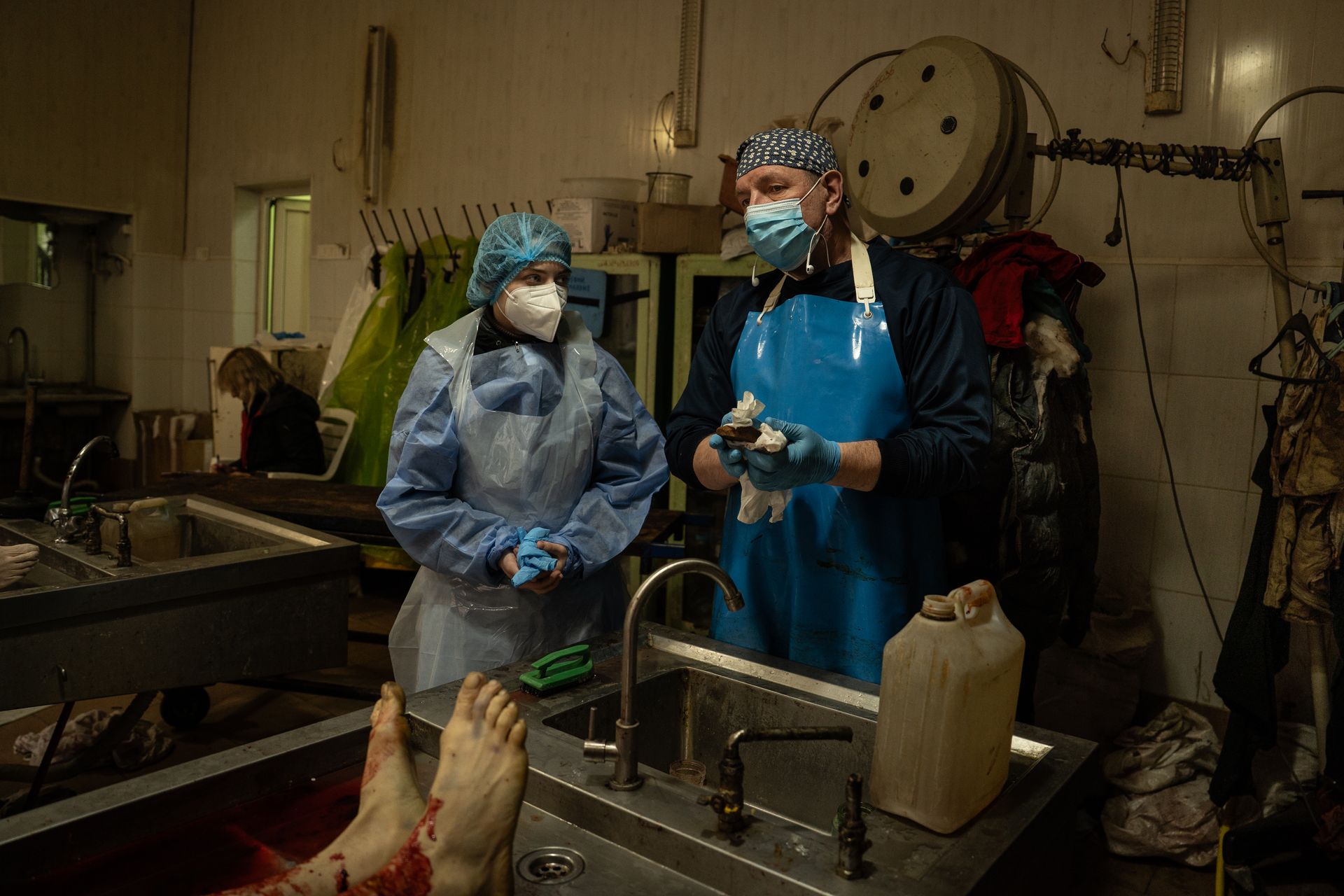 Forensic experts in the autopsy room in Kharkiv morgue in Kharkiv, Ukraine on Jan. 22, 2026.