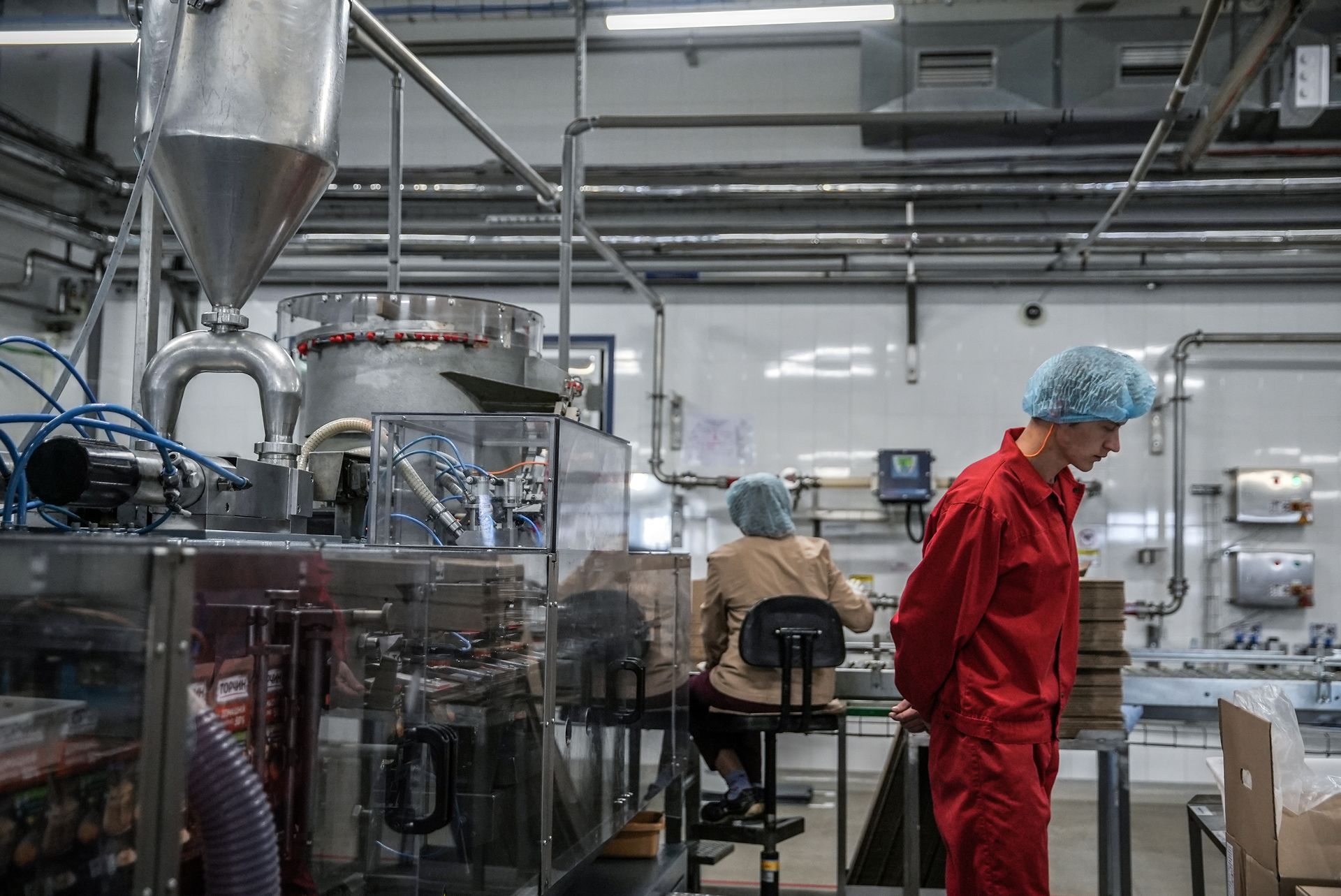 Workers are seen at the Nestle factory in Torchyn, Volyn Oblast, Ukraine, on Oct. 11, 2023.