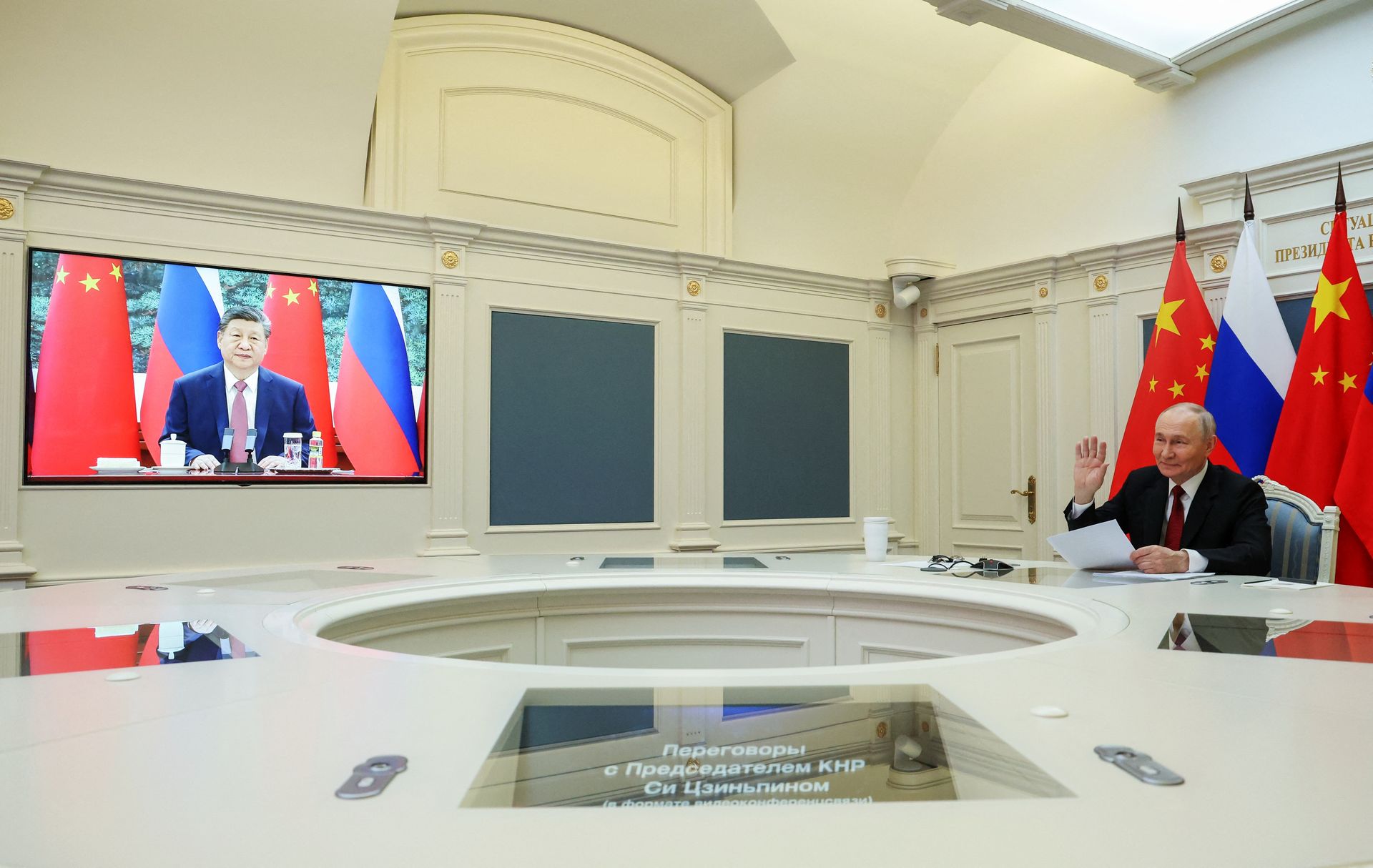 Russian President Vladimir Putin (R) holds a video call with Chinese President Xi Jinping (L) in Moscow, Russia, on Feb. 4, 2026.