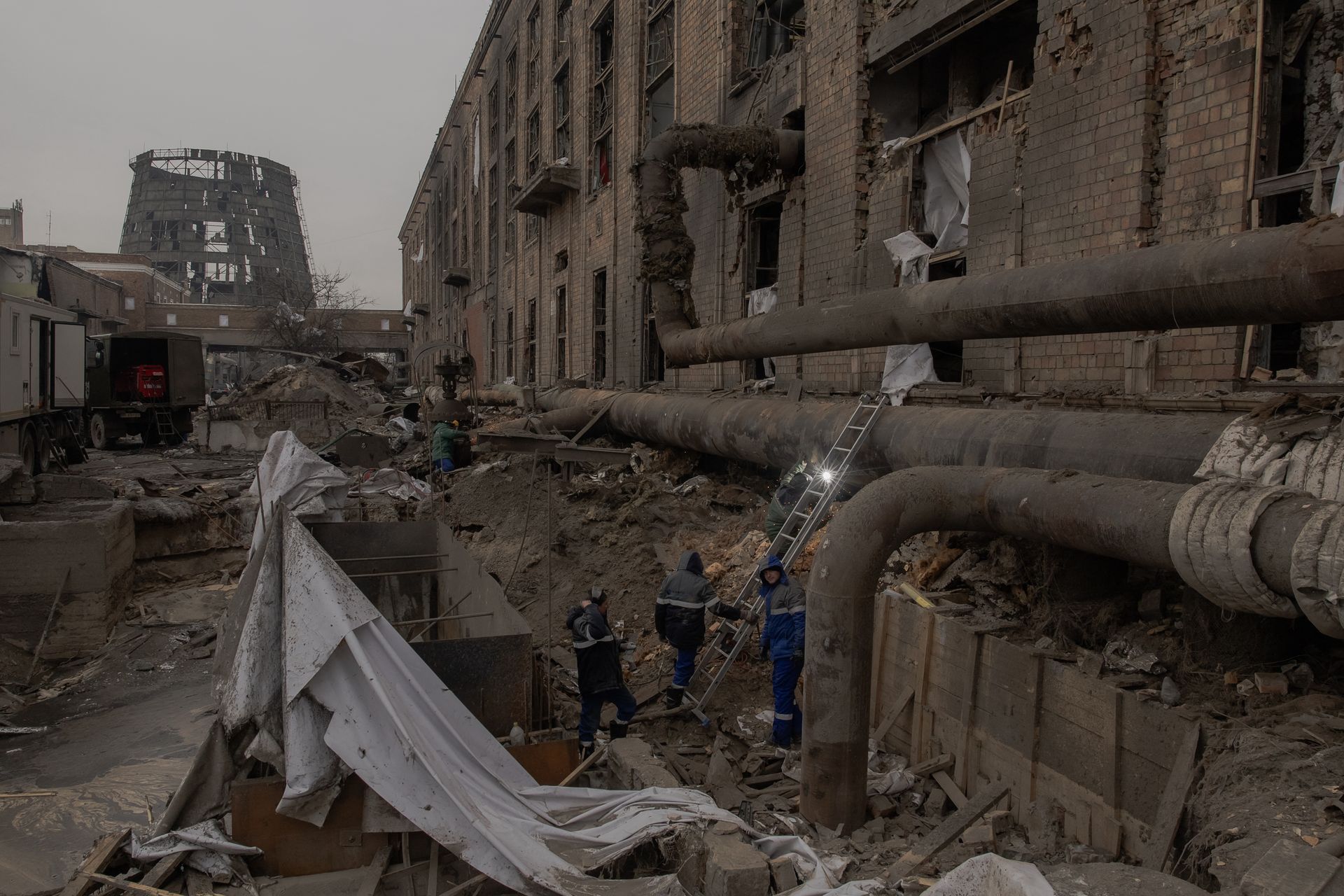 Employees repair sections of the Darnytska combined heat and power plant damaged by Russian air strikes in Kyiv, Ukraine, on Feb. 4, 2026.