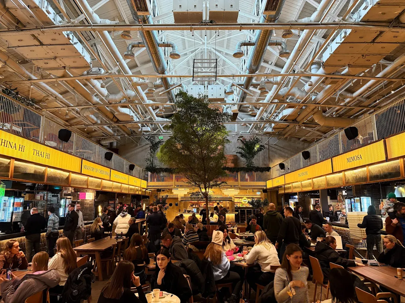 People hang out inside Kyiv Food market in Kyiv, Ukraine in an undated photo. 