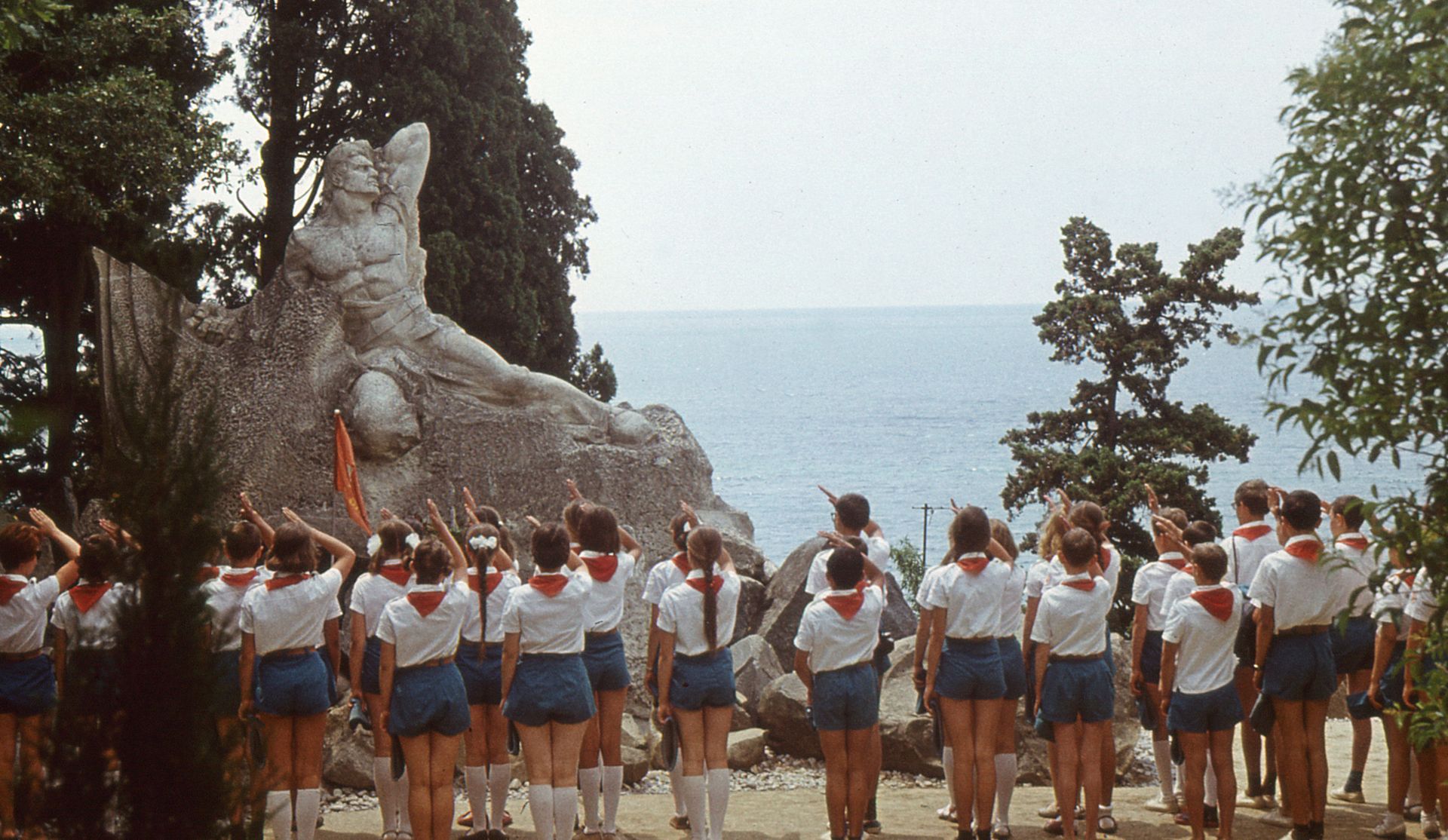 Children wearing pioneer uniforms during a flag-raising ceremony at the Memorial to the Unknown Soldier in the Artek Camp near Yalta, Crimea, in July 1972. 