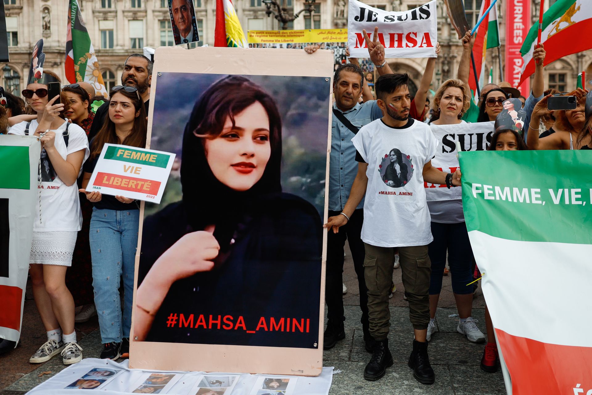 People take part in a demonstration organized by the “Women’s Life Freedom” movement to mark the first anniversary of Iranian Mahsa Amini’s death in Paris, France, on Sept. 16, 2023. 