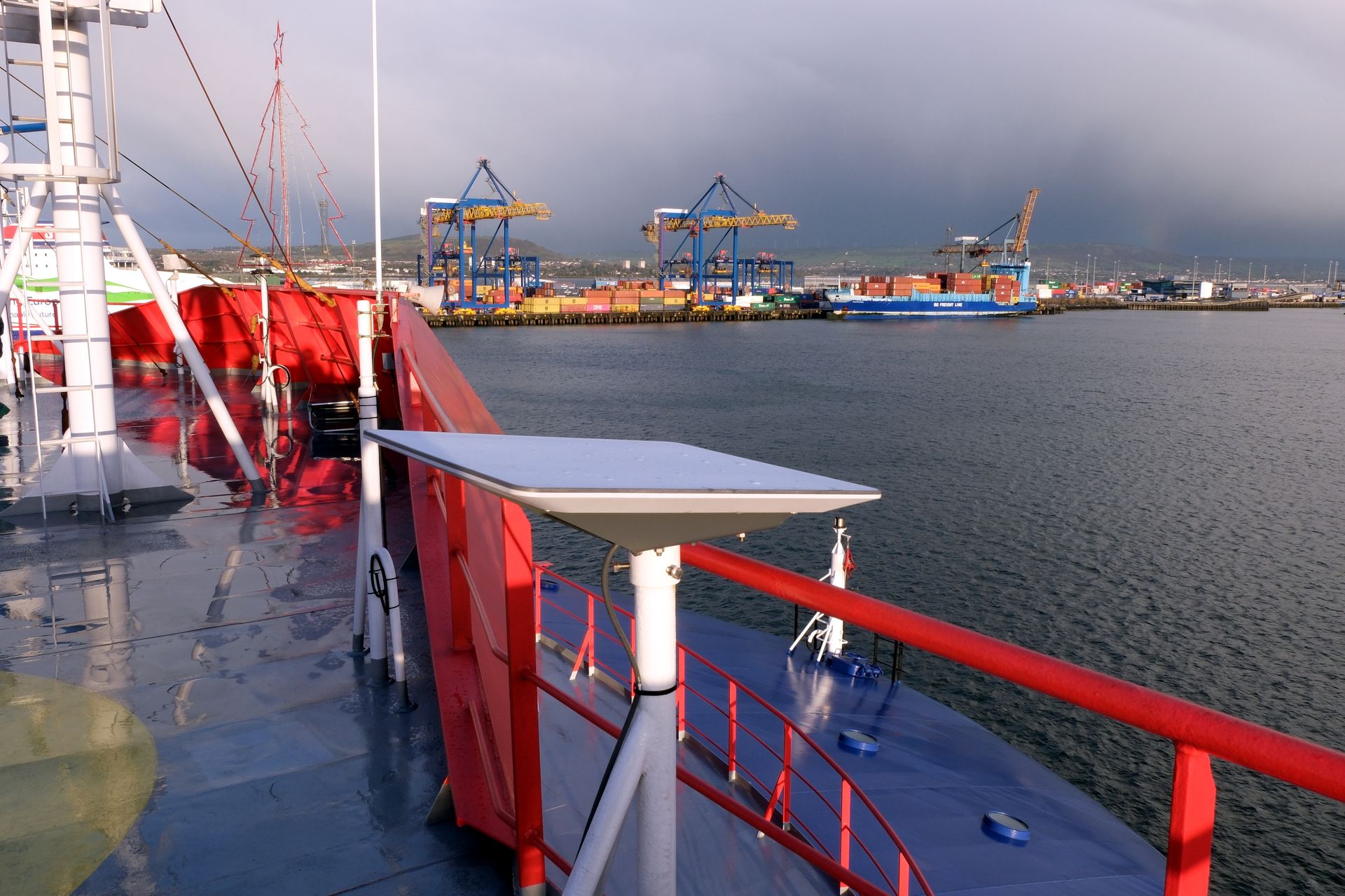 A Starlink antenna is mounted on the monkey island deck above the bridge of a heavy-lift ship moored in the port in Belfast, United Kingdom, on Dec. 19, 2024.