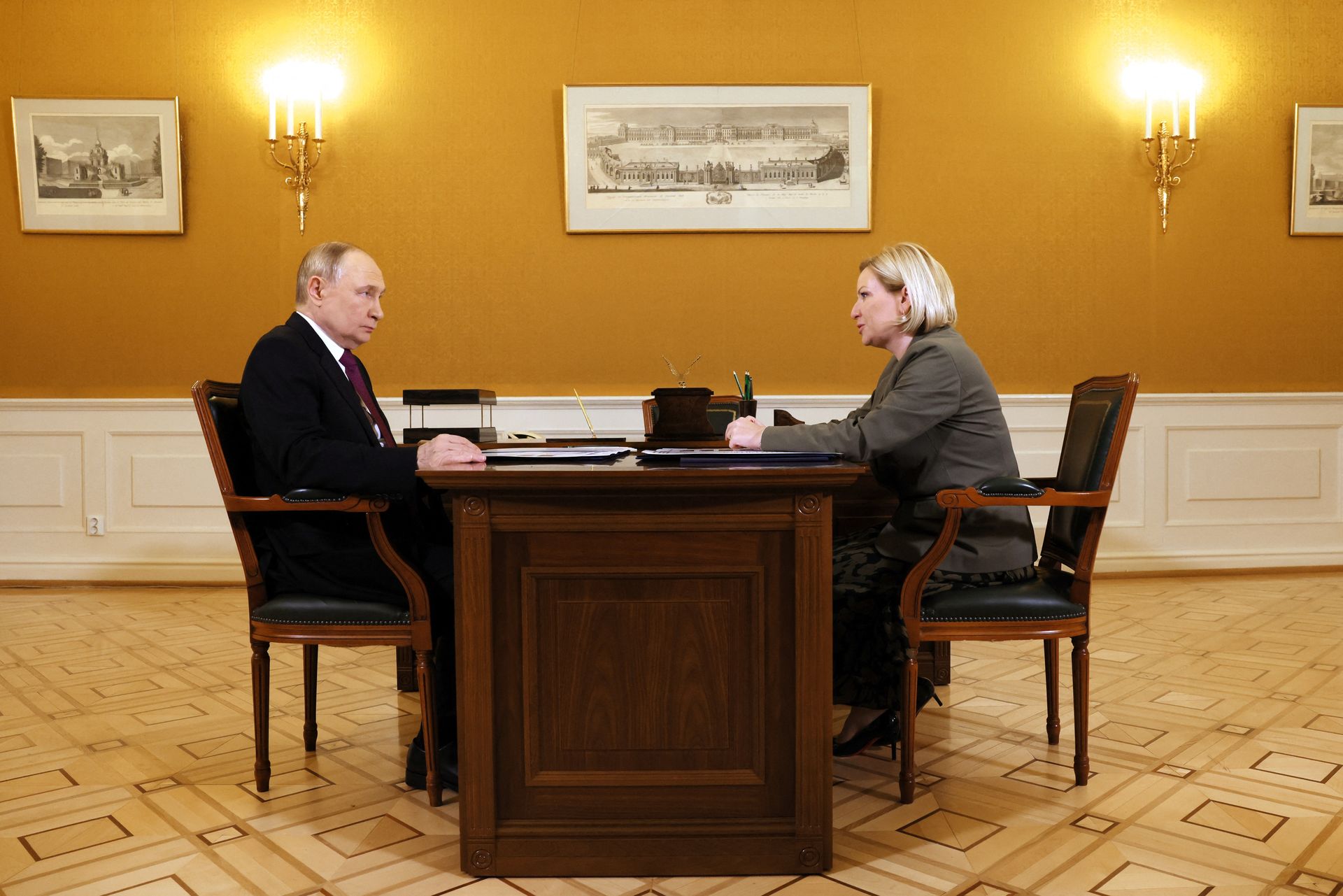 Russian President Vladimir Putin (L) meets Russian Minister of Culture Olga Lyubimova (R) near Saint Petersburg, Russia, on Sept. 12, 2025.
