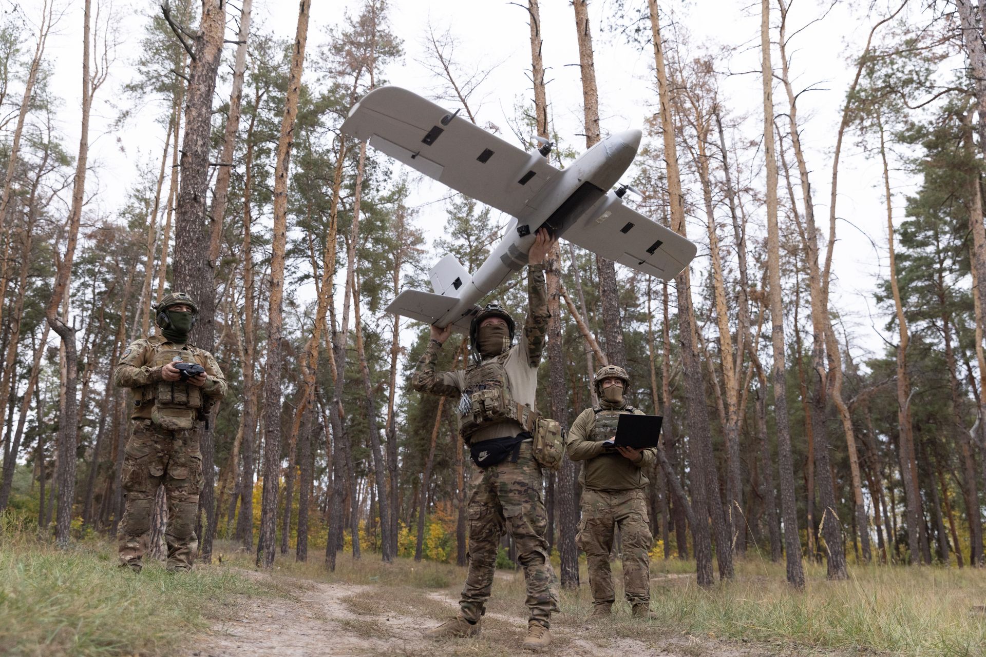 Ukrainian soldiers prepare an "Evanger" UAV for launch in Kharkiv Oblast, Ukraine, on Sept. 24, 2025.