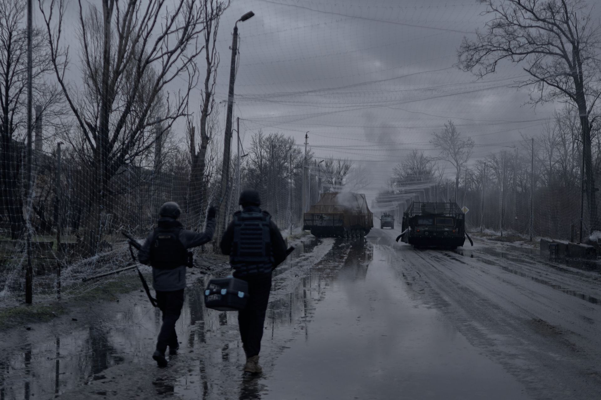 Soldiers walk towards destroyed Ukrainian armored vehicles sitting along the roadside between Druzhkivka and Kostyantynivka, Donetsk Oblast, Ukraine, on Feb. 13, 2026.