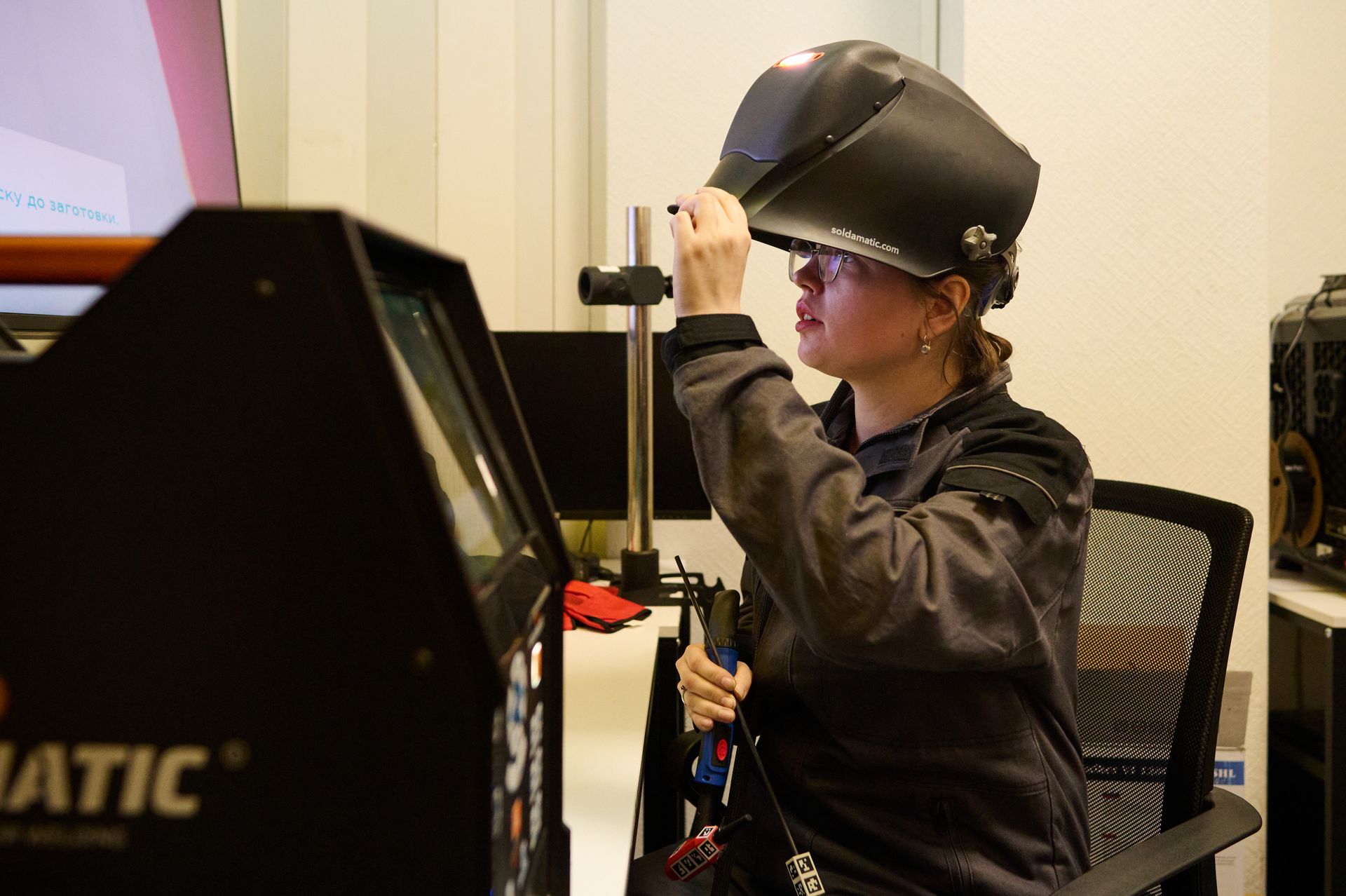 A KSE ProfTech instructor sets up a welding simulator before the students' training session at the KSE ProfTech facility in Kyiv, Ukraine, on Feb. 25, 2026.