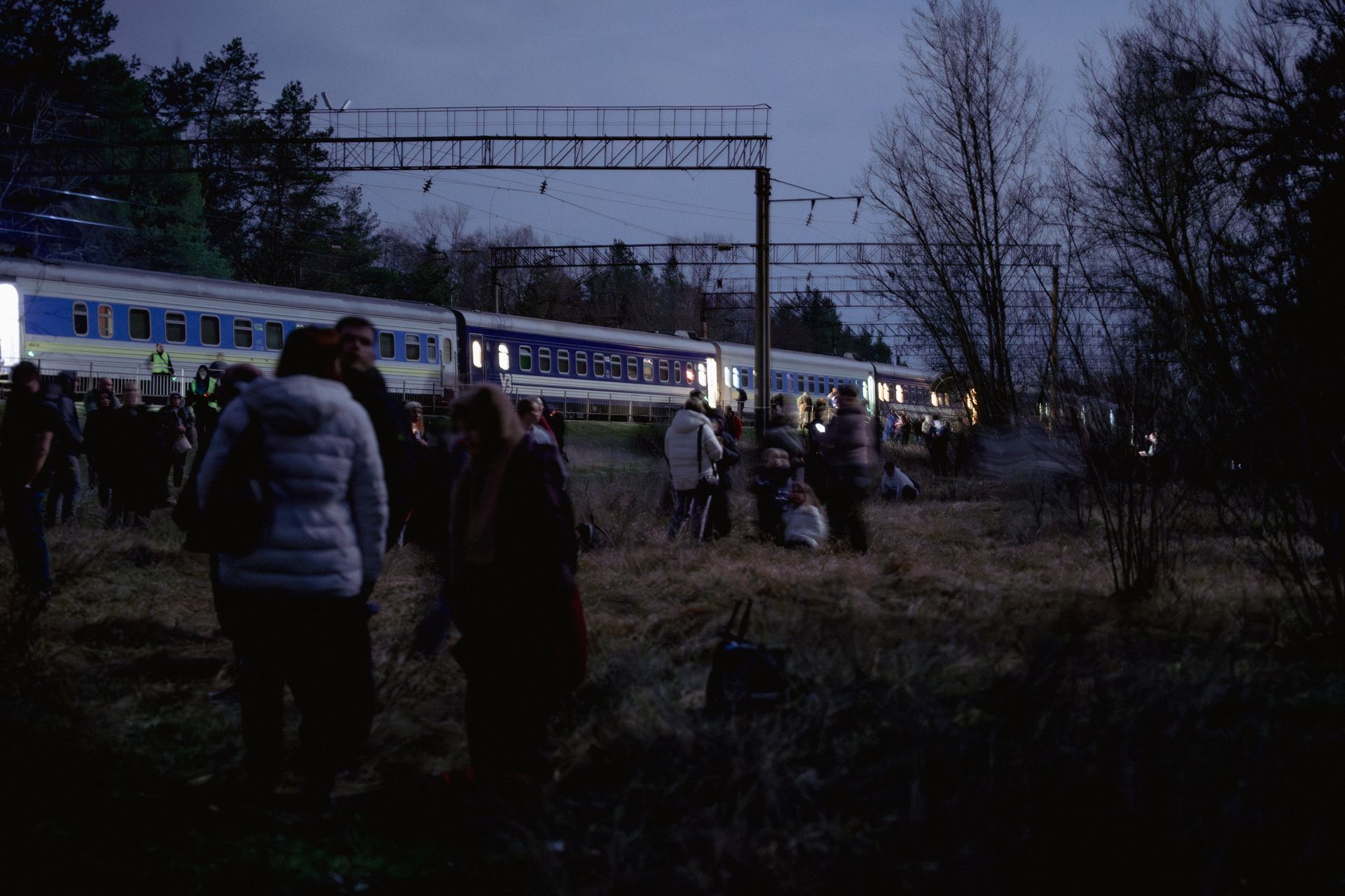 Passengers of the Kharkiv-Vorokhta train return to their carts after a Russian drone attack threat in Poltava Oblast, Ukraine, on April 1, 2026.