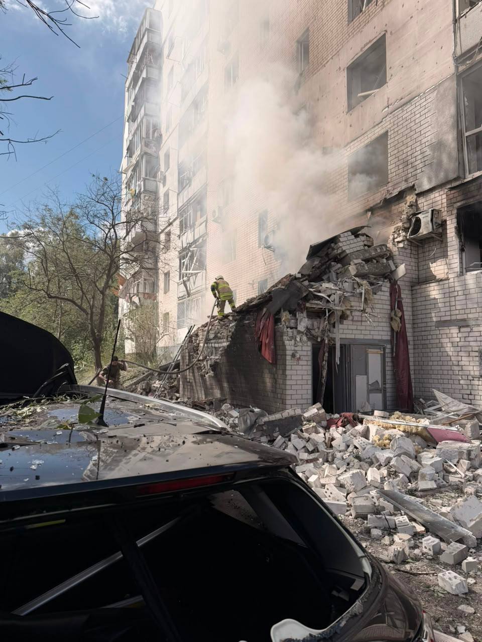Emergency responders at the residential building struck in central Chernihiv